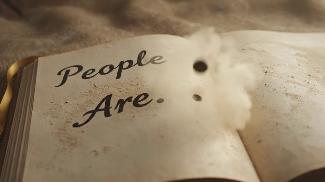 Frame 6: The full text is revealed on the left page — 'People Are.' in elegant handwritten script, followed by a period. A full stop. The sentence is complete as written. The right page remains blank. Dust settles around the open book. The book of Truth opens and its first entry refuses to editorialize.